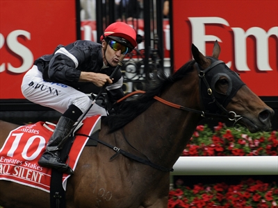Jockey Dwayne Dunn rides All Silent to a win in the Emirates Stakes