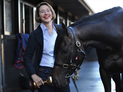 Gai Waterhouse poses with a horse.